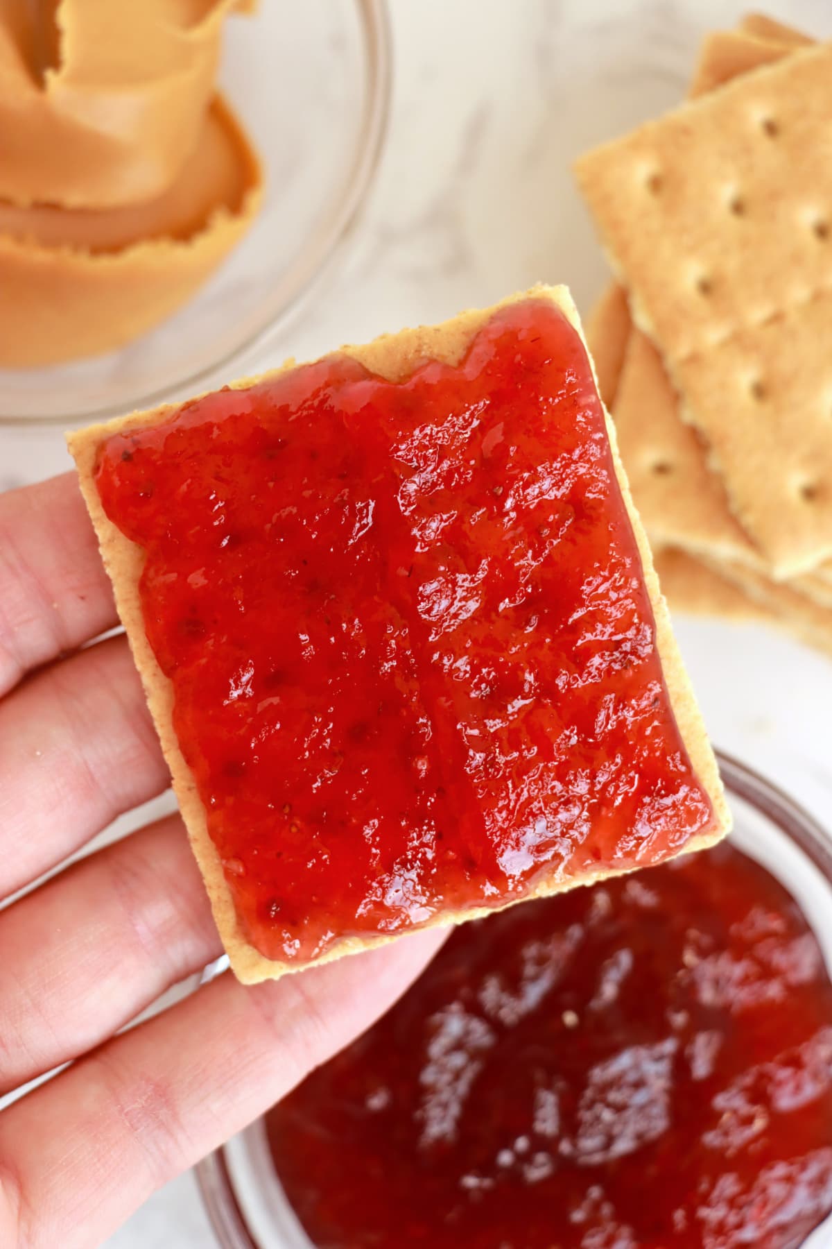 Peanut butter and jelly graham cracker sandwich.